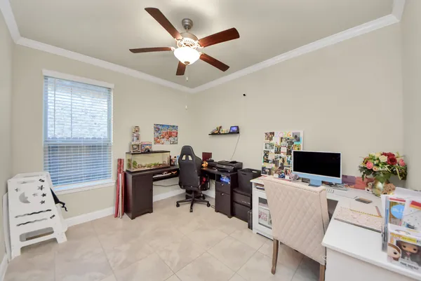 a work room with furniture and wooden floor