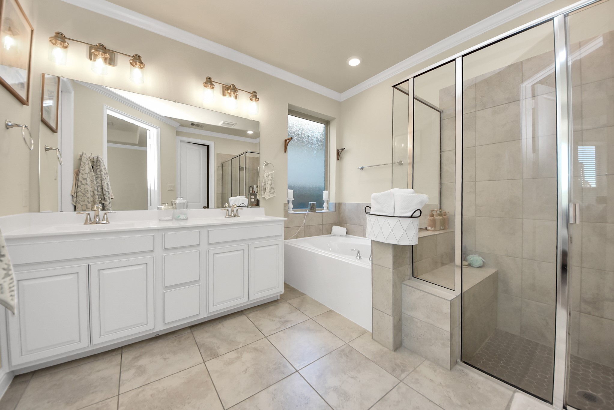 6703 Sandia Crest Street Spring, TX 77379 - Photo 27 of 45 a bathroom with a double vanity sink mirror and shower