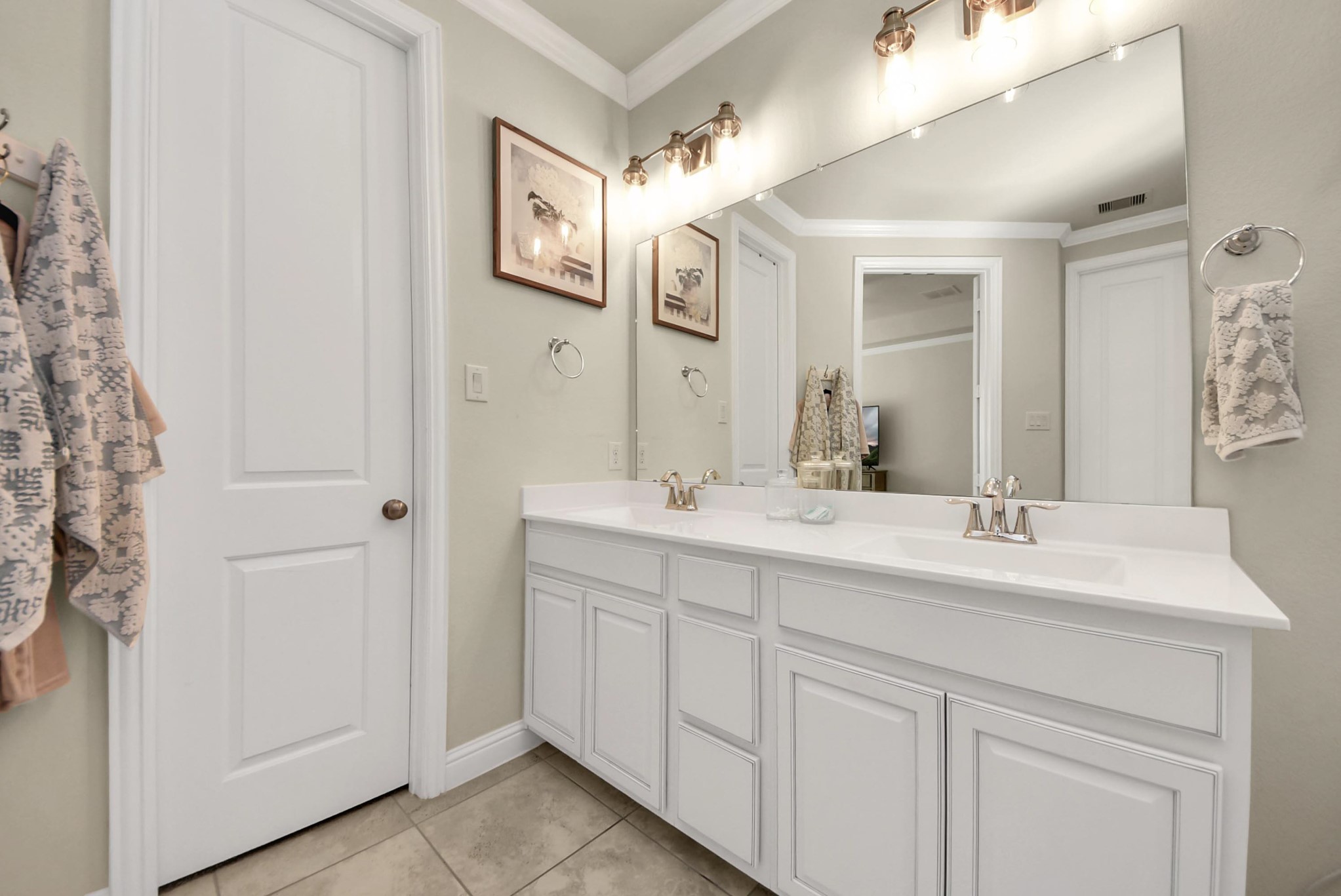 6703 Sandia Crest Street Spring, TX 77379 - Photo 28 of 45 a bathroom with a double vanity sink and a mirror