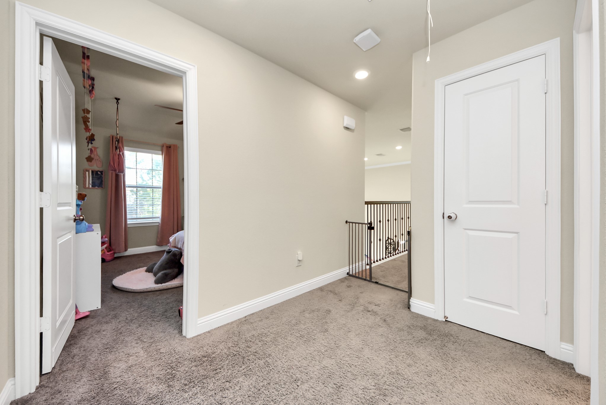 6703 Sandia Crest Street Spring, TX 77379 - Photo 30 of 45 wooden floor in an empty room and a bathroom