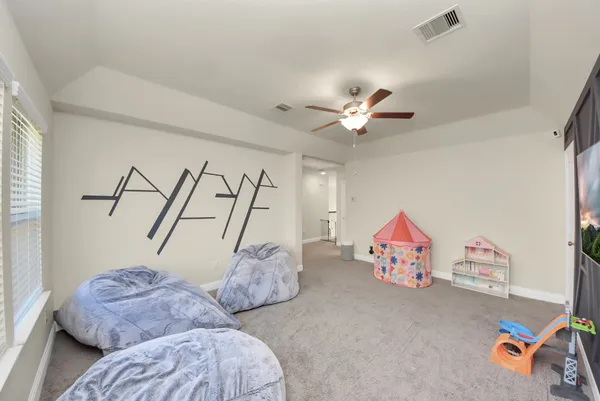 a bedroom with furniture and a chandelier
