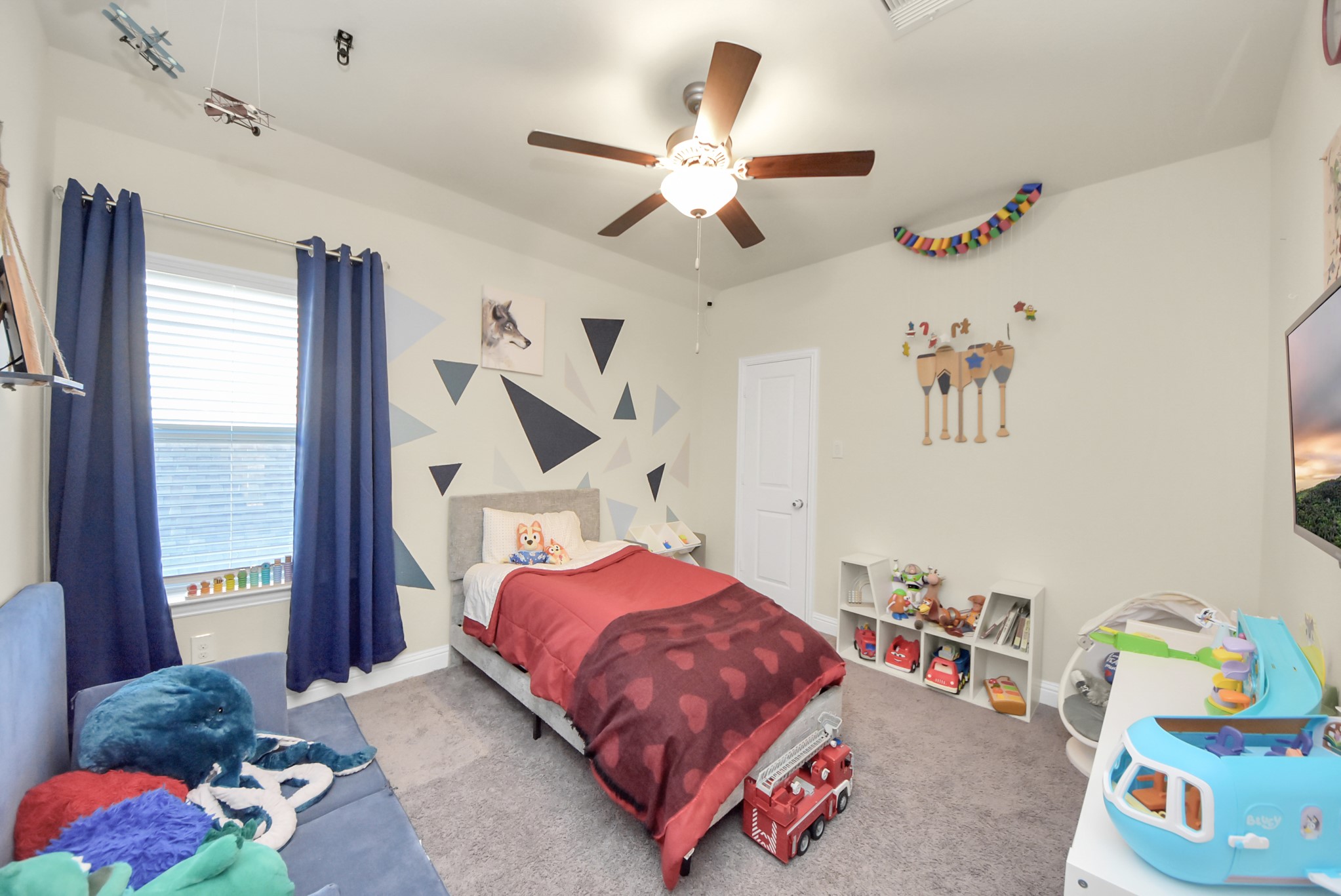 6703 Sandia Crest Street Spring, TX 77379 - Photo 36 of 45 a bedroom with a bed and a large window