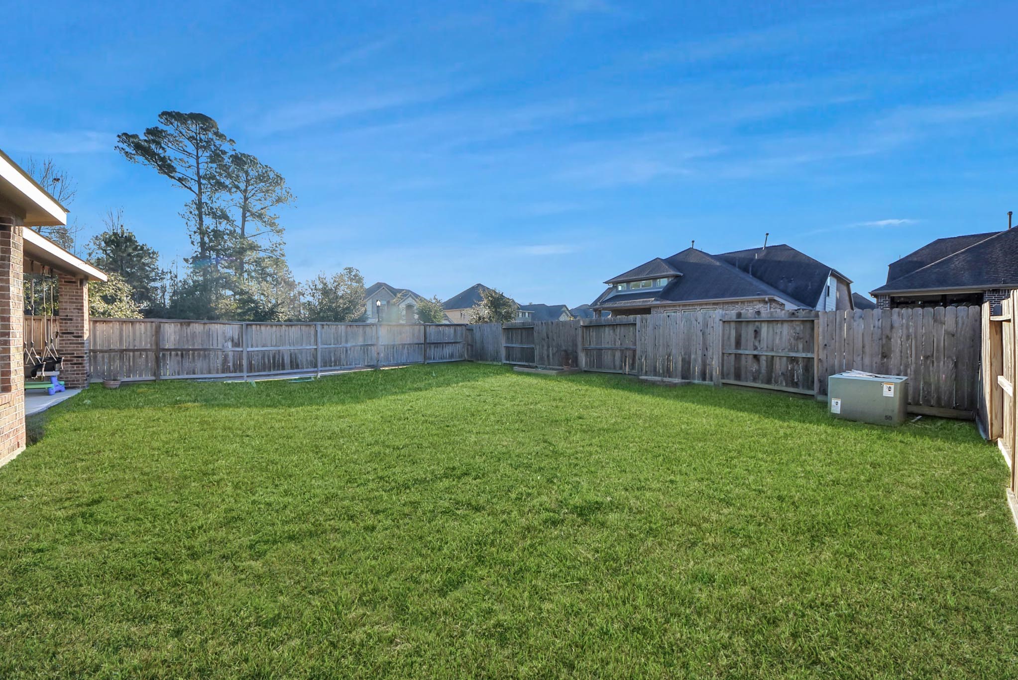 6703 Sandia Crest Street Spring, TX 77379 - Photo 39 of 45 a view of a house with a backyard