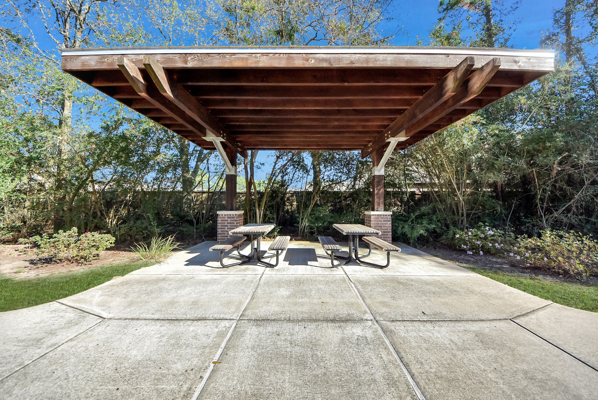 6703 Sandia Crest Street Spring, TX 77379 - Photo 40 of 45 a view of patio with a table and chairs under an umbrella with a barbeque