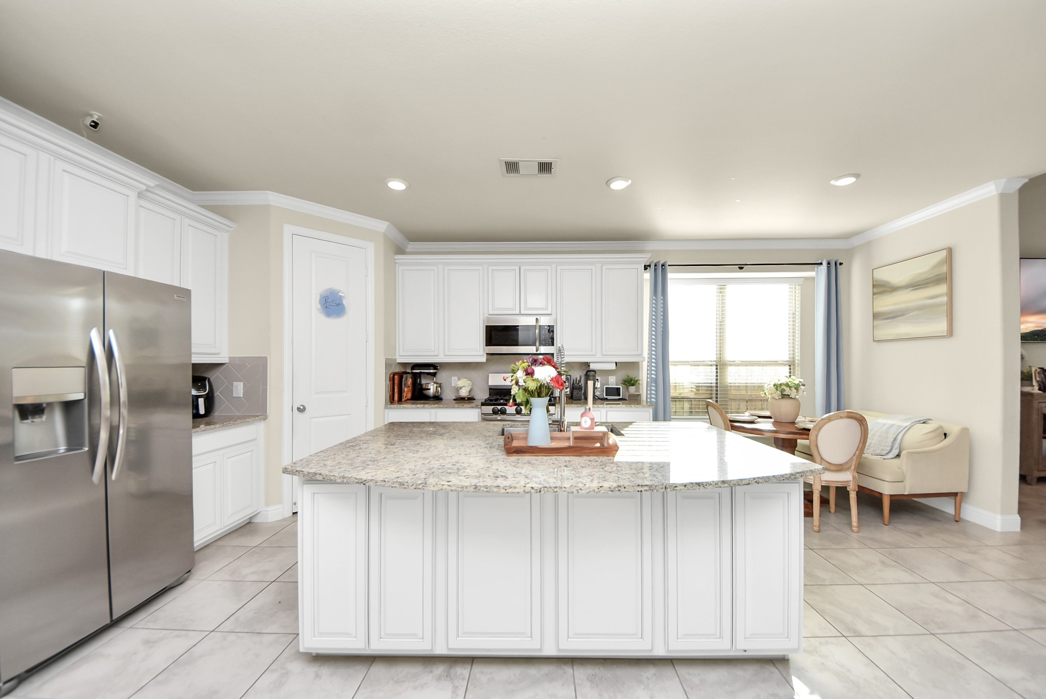 6703 Sandia Crest Street Spring, TX 77379 - Photo 8 of 45 a view of a kitchen with kitchen island granite countertop lots of counter top space