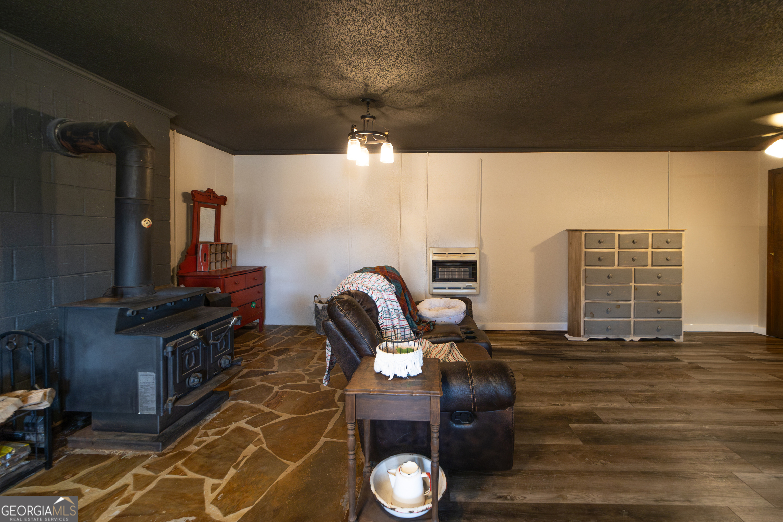 1448 Bohannon Road Grantville, GA 30220 - Photo 45 of 61 Downstairs living area and potbelly stove