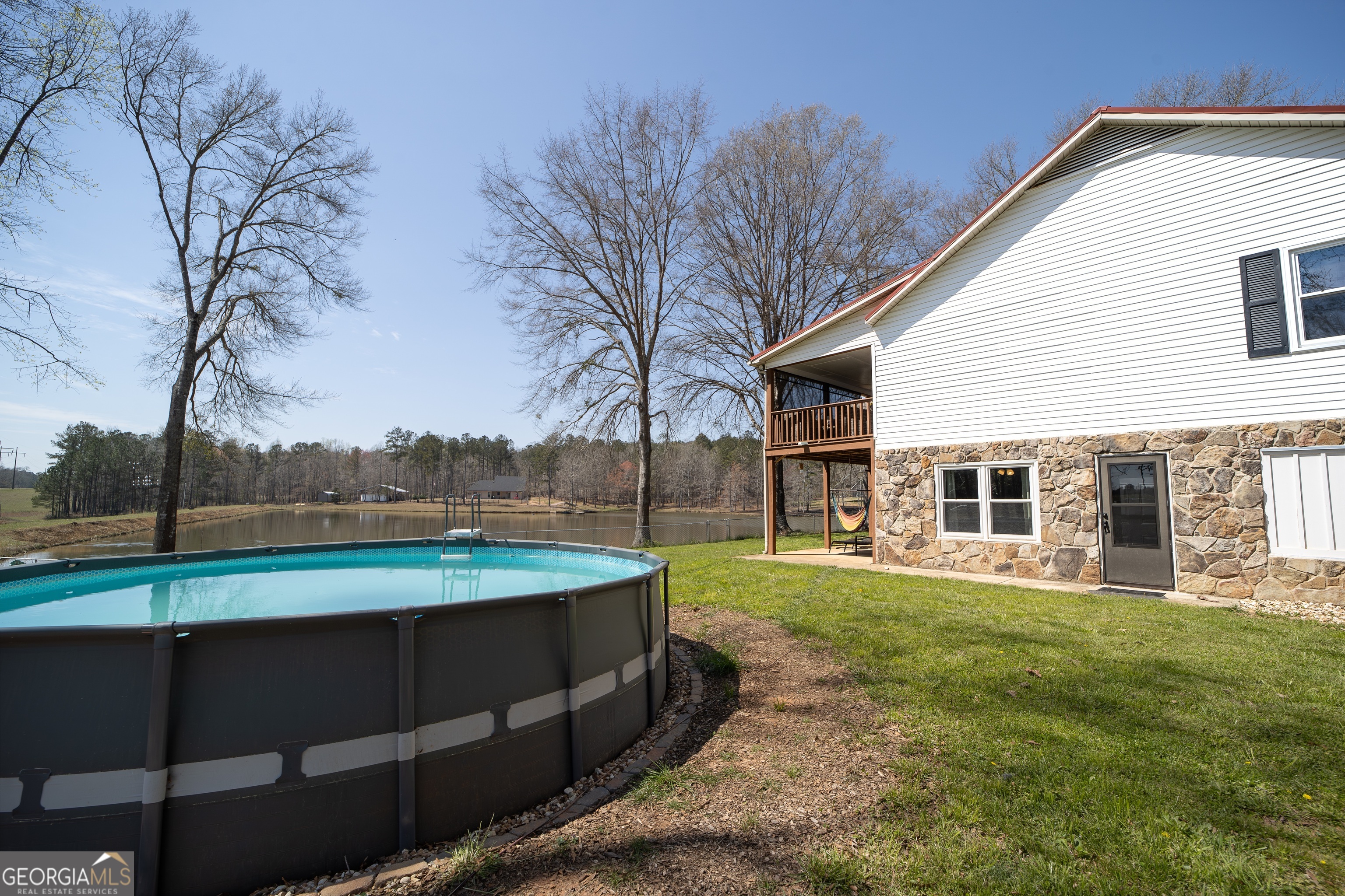1448 Bohannon Road Grantville, GA 30220 - Photo 47 of 61 Above ground pool and exterior entry #2 to downstairs