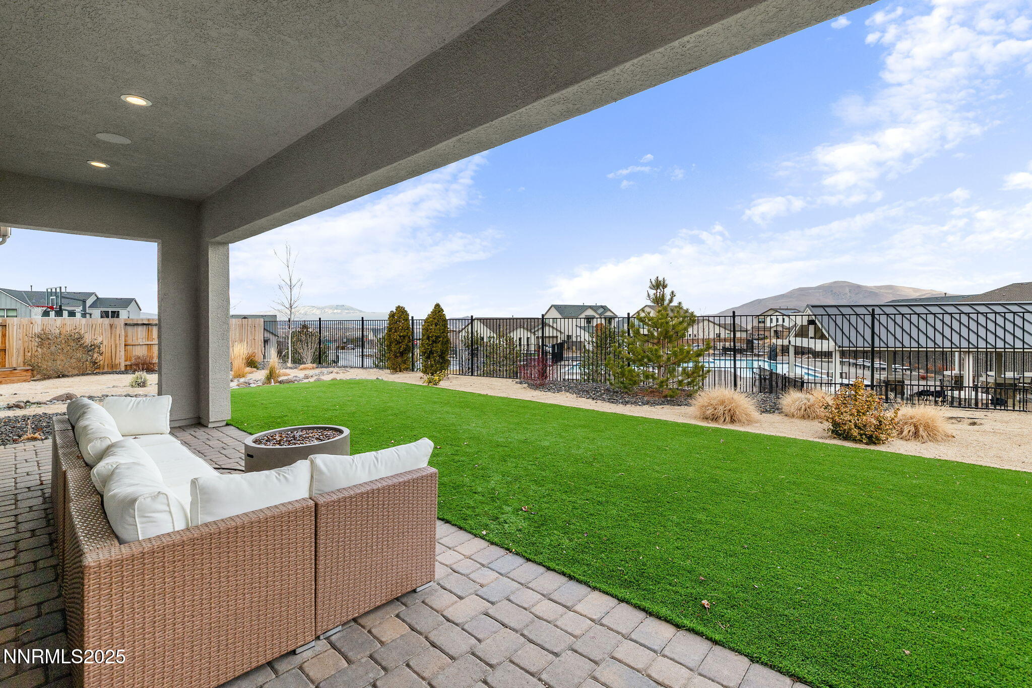 3011 Silverberry Lane Reno, NV 89521 - Photo 19 of 25 a view of a patio with couches potted plants and a big yard