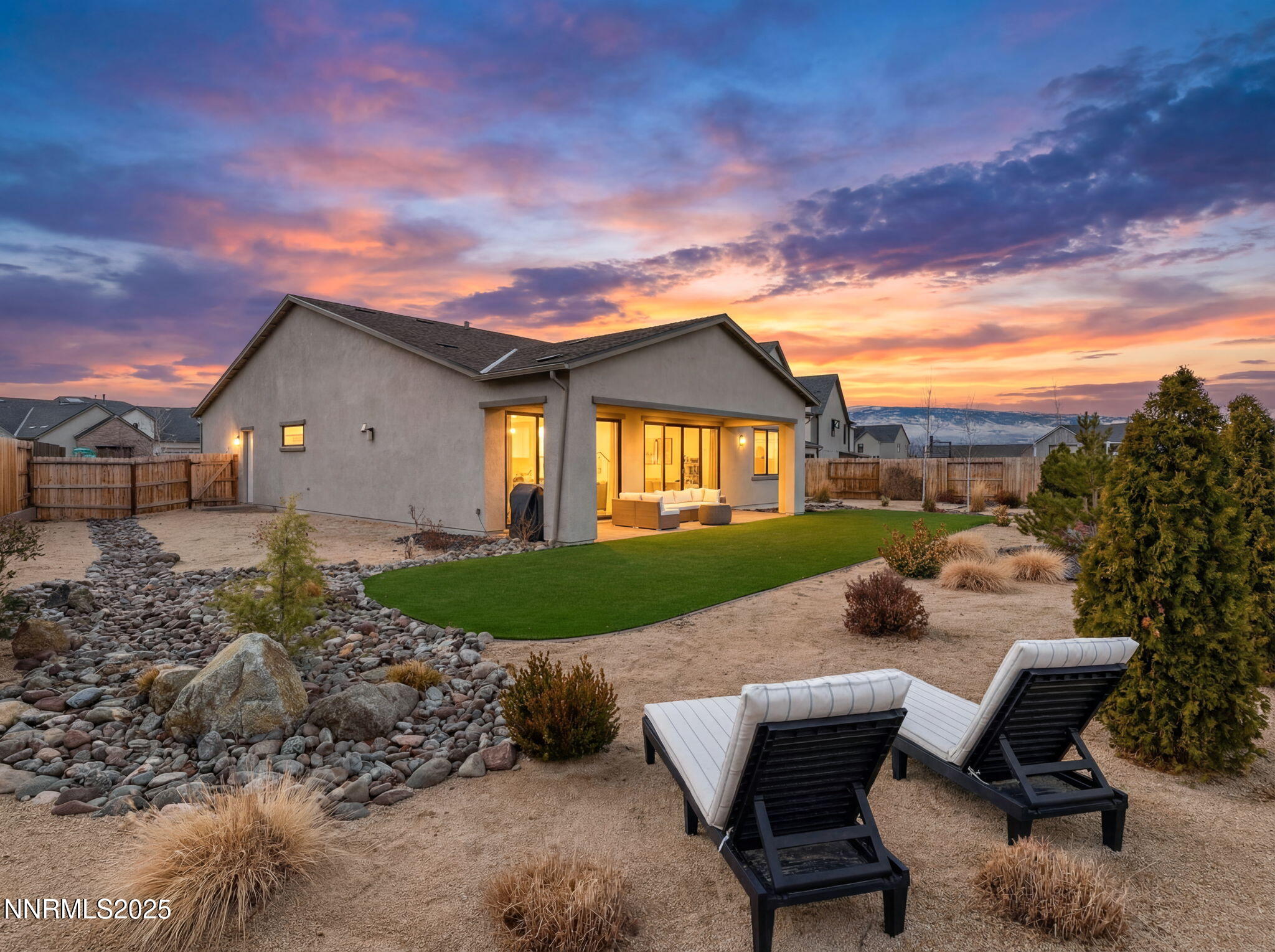 3011 Silverberry Lane Reno, NV 89521 - Photo 2 of 25 a view of a patio with table and chairs and potted plants