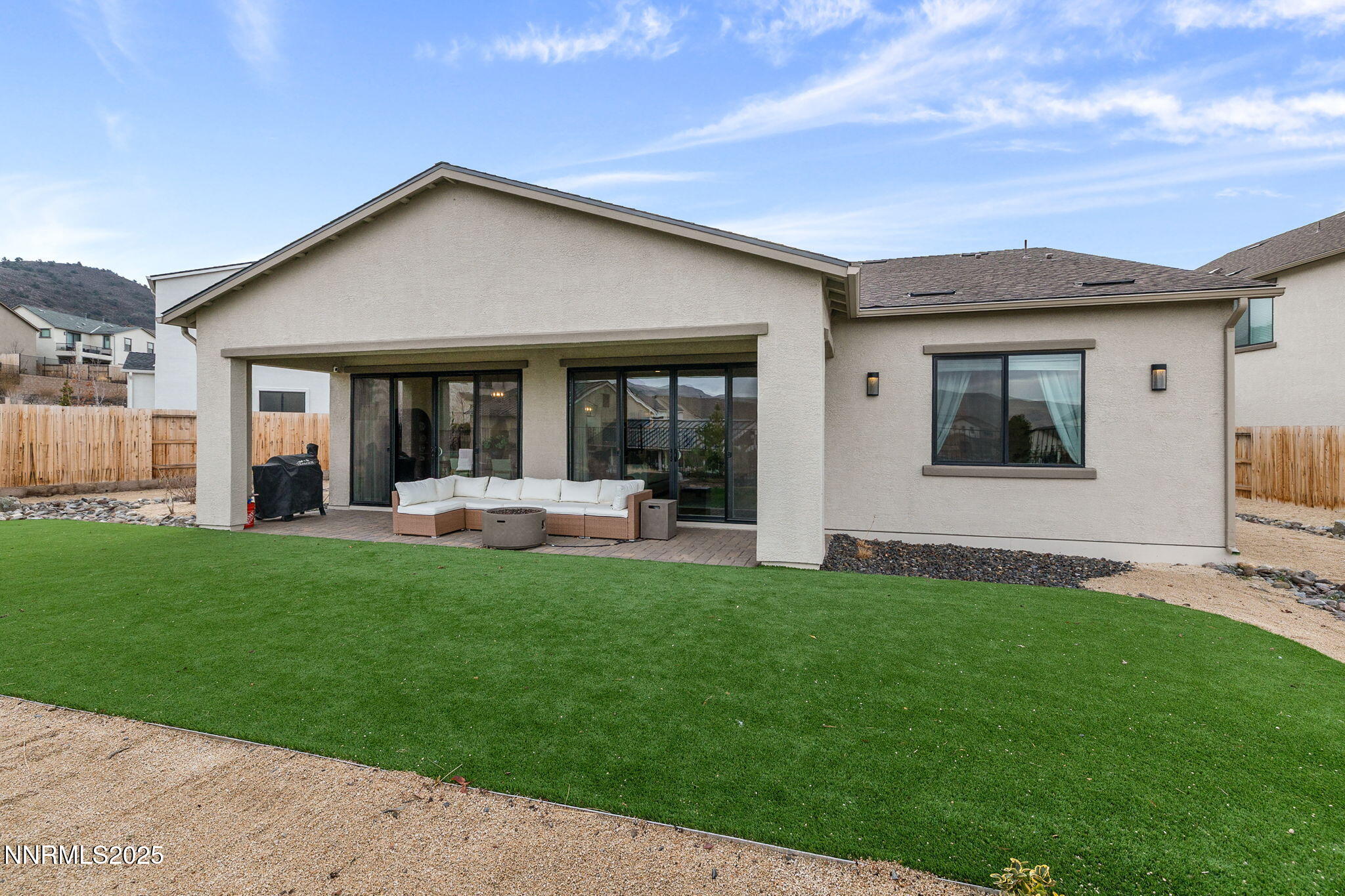 3011 Silverberry Lane Reno, NV 89521 - Photo 21 of 25 a front view of a house with a yard
