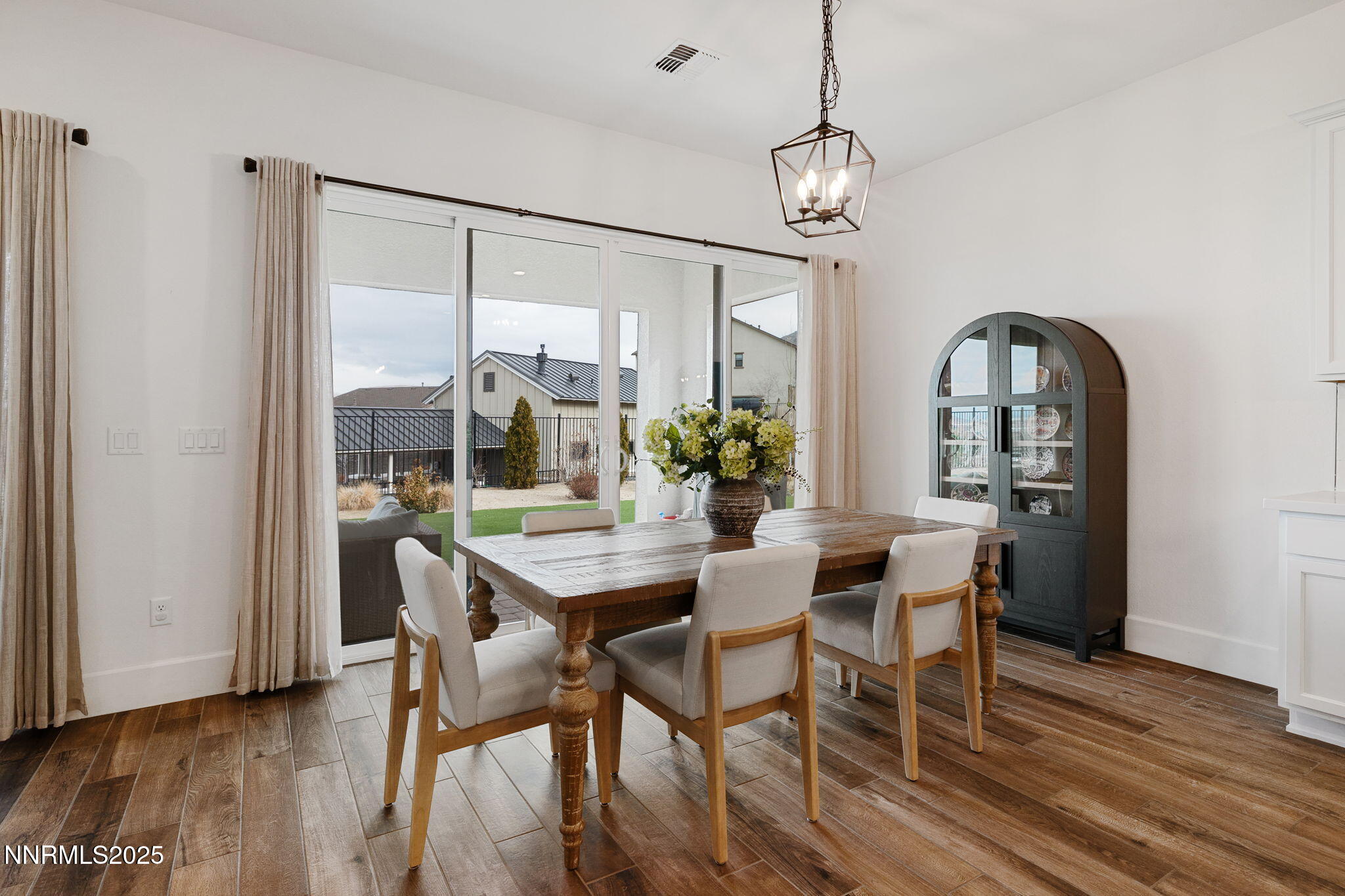 3011 Silverberry Lane Reno, NV 89521 - Photo 7 of 25 a view of a dining room with furniture window and wooden floor