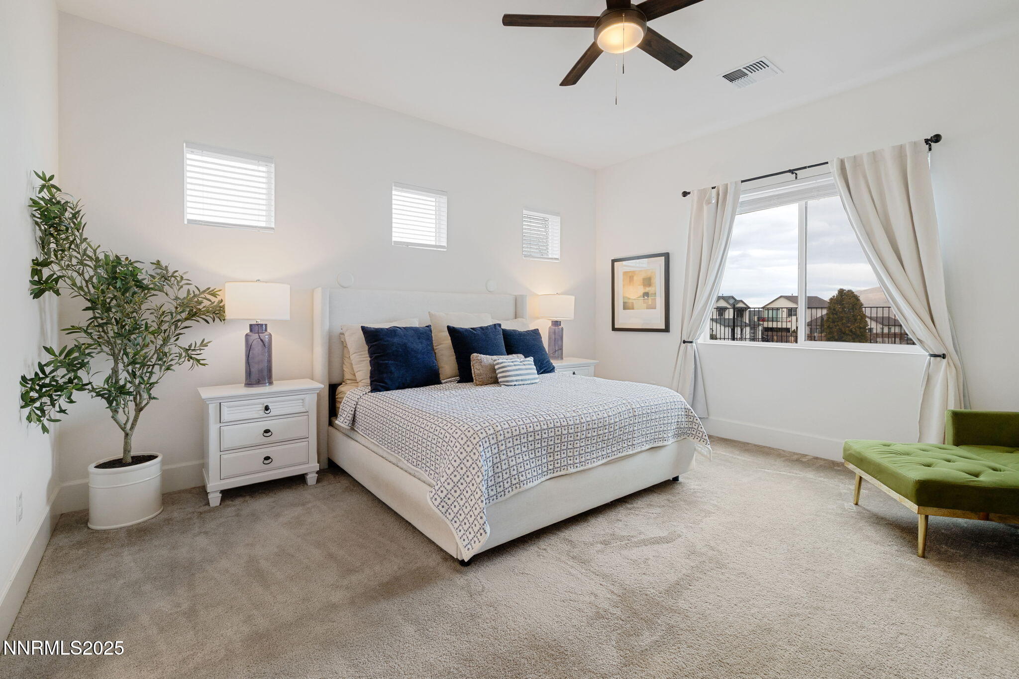 3011 Silverberry Lane Reno, NV 89521 - Photo 10 of 25 a bedroom with a large bed and a potted plant