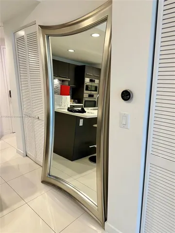 a bedroom with a bed and dresser