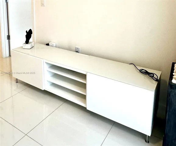 a bedroom with a bed and a cabinets