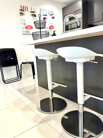 a kitchen with a table and a stove