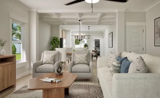 a living room with furniture and a chandelier