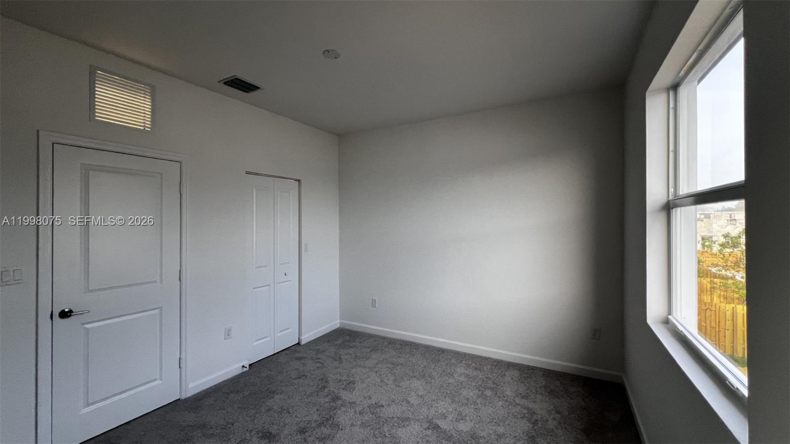 15583 Southwest 277th Street, Unit 15583 Homestead, FL 33032 - Photo 20 of 27 an empty room with windows