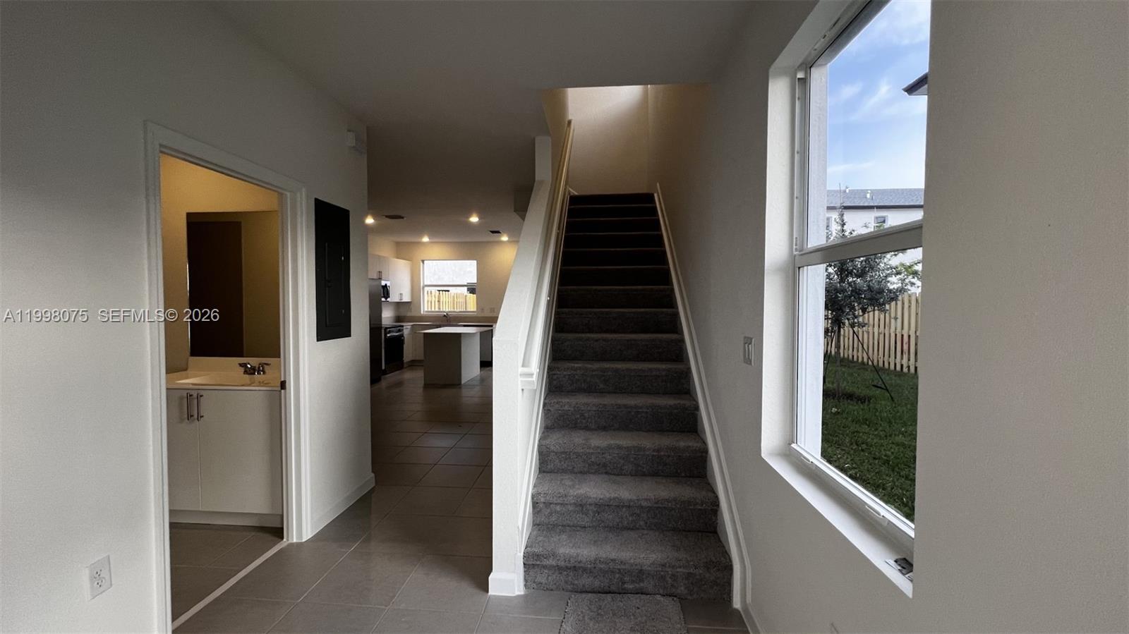 15583 Southwest 277th Street, Unit 15583 Homestead, FL 33032 - Photo 2 of 27 a view of entryway and hall with wooden floor