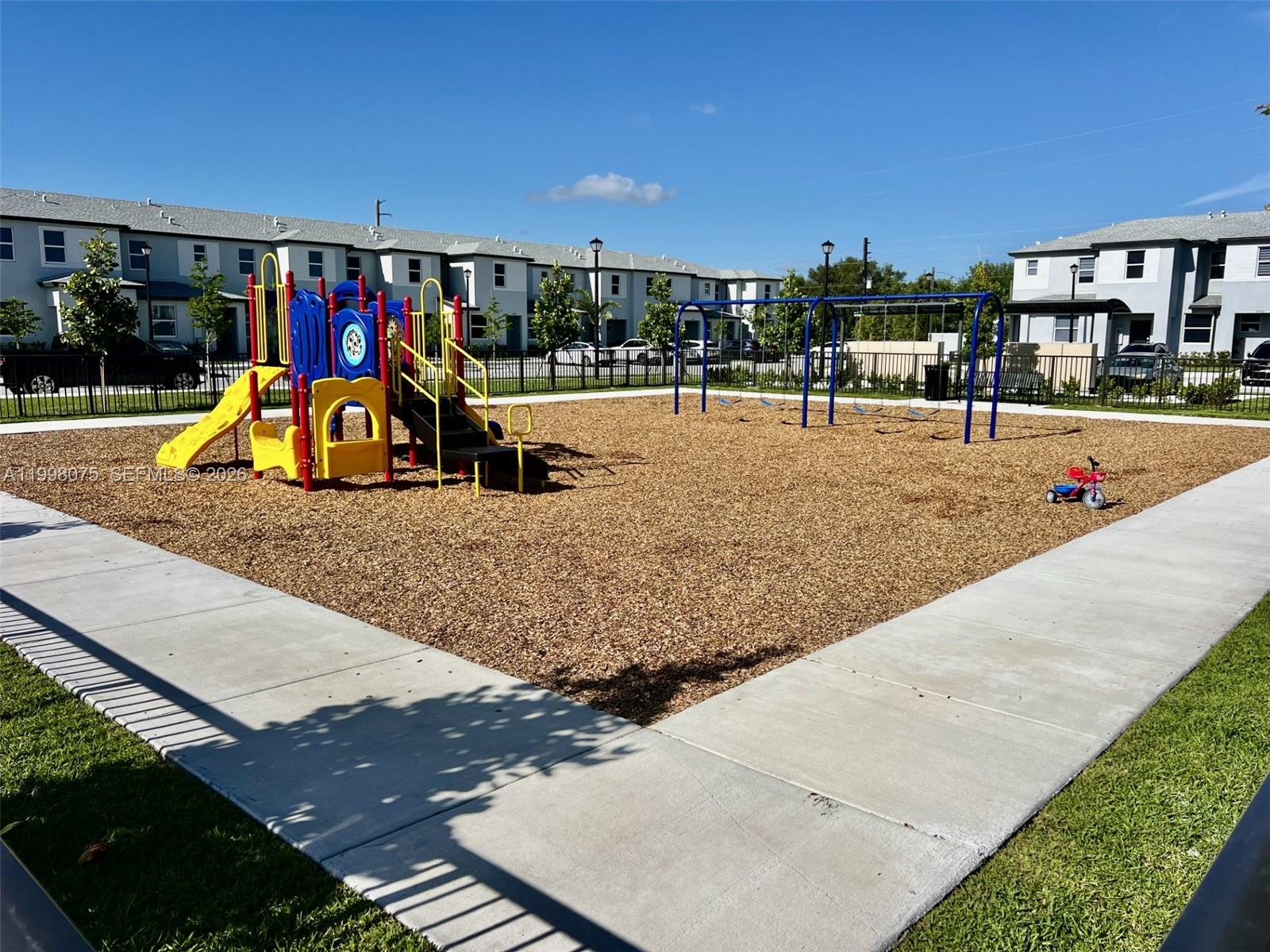 15583 Southwest 277th Street, Unit 15583 Homestead, FL 33032 - Photo 25 of 27 a view of outdoor space with seating