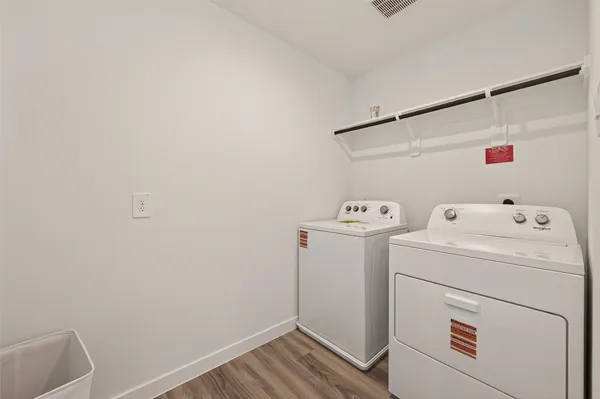a utility room with dryer and washer