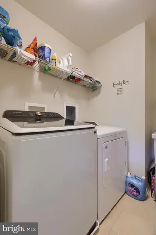 a close view of laundry room with a washer and dryer