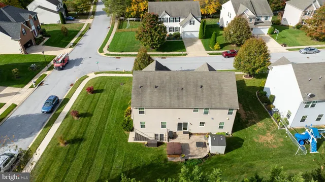 an aerial view of a house with a garden