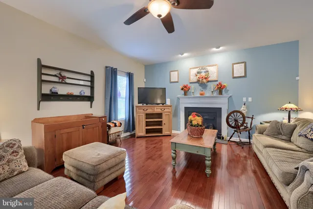 a living room with furniture fireplace and flat screen tv