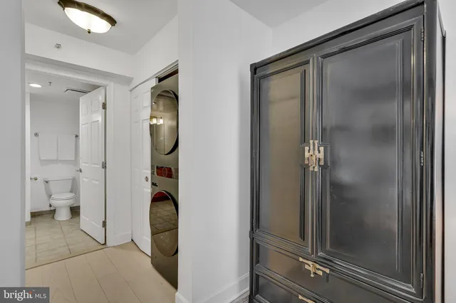 a bathroom with a glass door shower and a sink