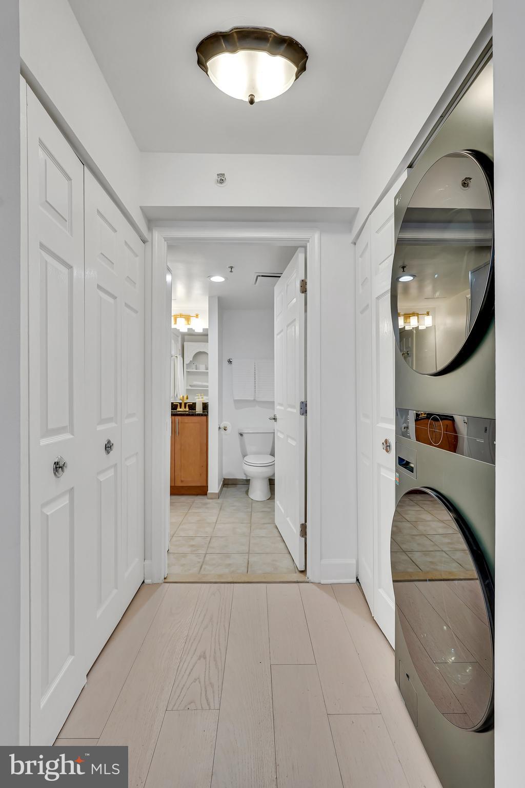3401 38th Street Northwest, Unit 407 Washington, DC 20016 - Photo 23 of 37 a view of a livingroom with furniture and mirror