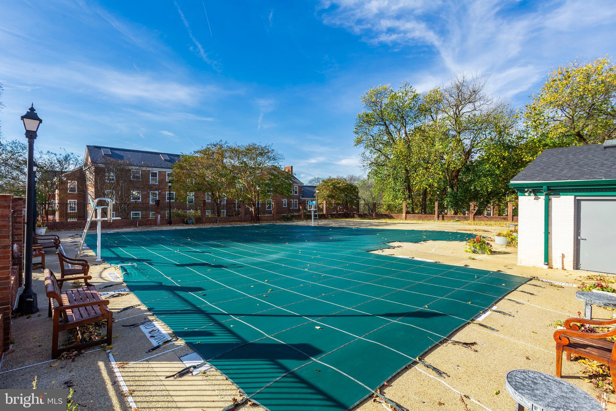 3401 38th Street Northwest, Unit 407 Washington, DC 20016 - Photo 31 of 37 a view of a swimming pool with a yard