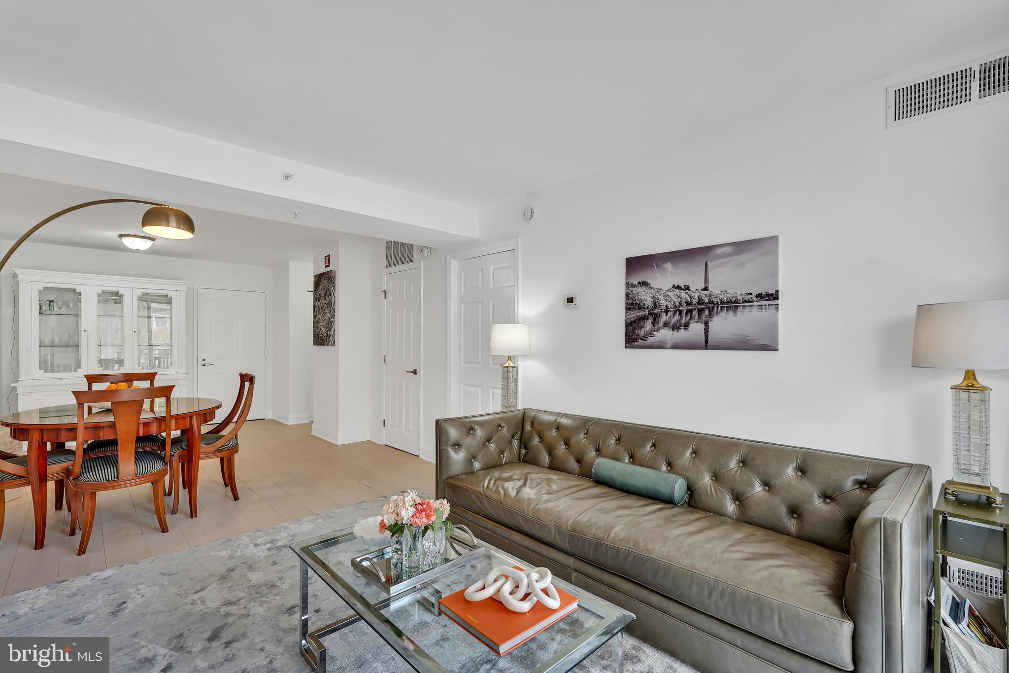 3401 38th Street Northwest, Unit 407 Washington, DC 20016 - Photo 8 of 37 a living room with furniture and a large window