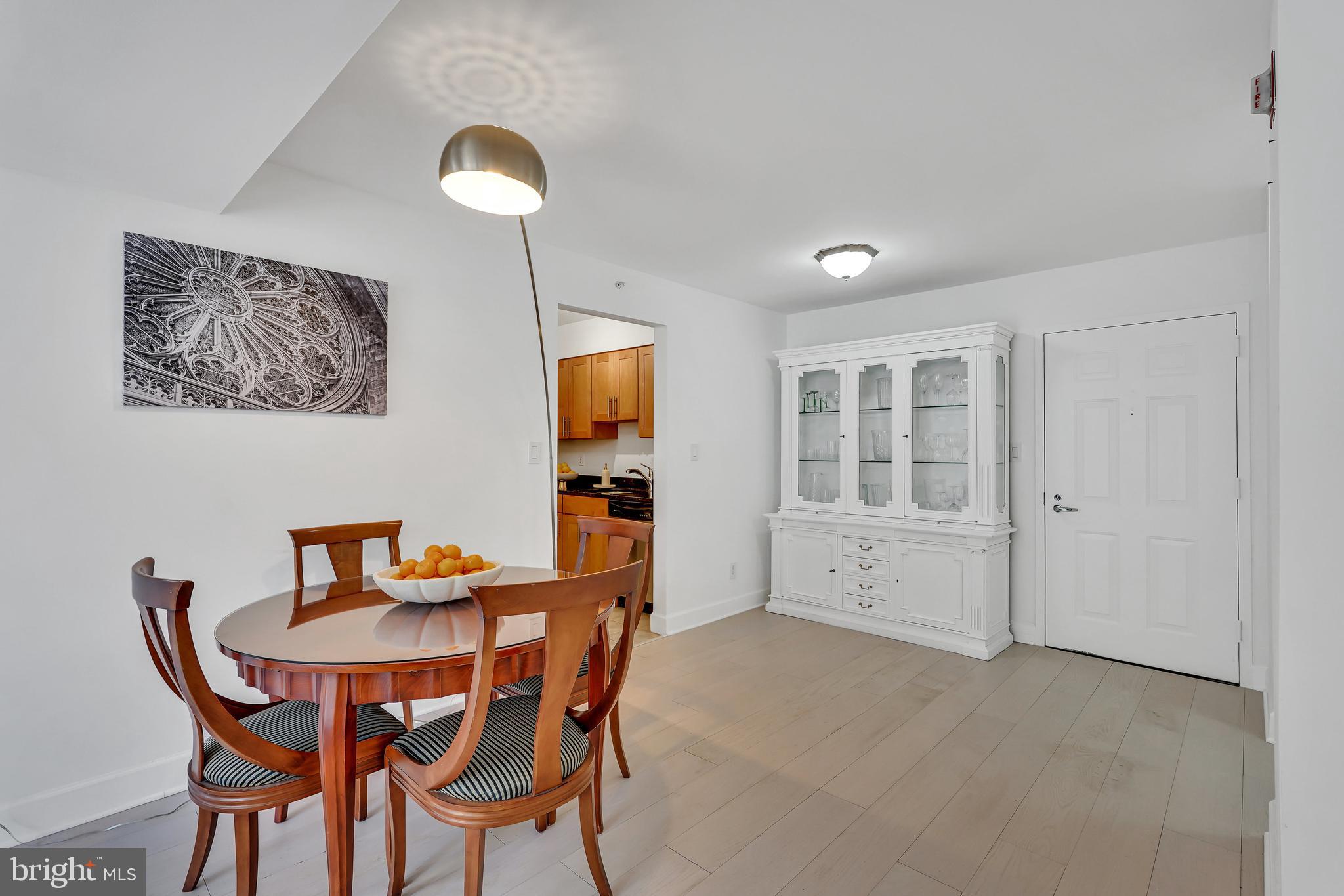 3401 38th Street Northwest, Unit 407 Washington, DC 20016 - Photo 10 of 37 a view of a dining room with furniture and wooden floor