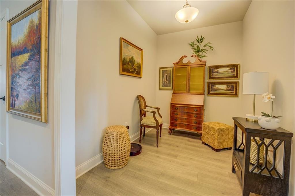 616 Haven Way Monroe, GA 30655 - Photo 13 of 40 a bedroom with furniture and wooden floor