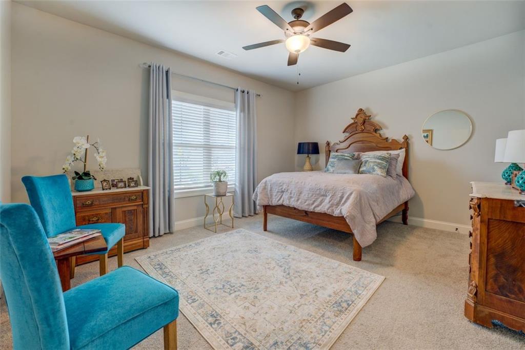 616 Haven Way Monroe, GA 30655 - Photo 22 of 40 a bedroom with a bed dresser and a window