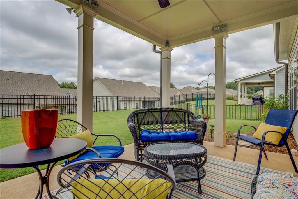 616 Haven Way Monroe, GA 30655 - Photo 35 of 40 a roof deck with table and chairs and wooden floor
