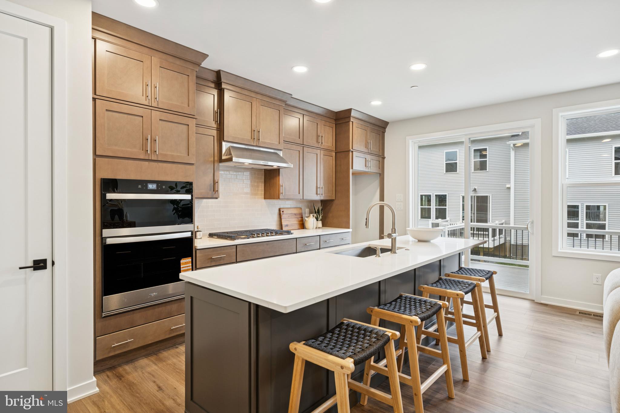 321 Gilman Street Malvern, PA 19355 - Photo 11 of 25 a kitchen with a stove a sink and a refrigerator