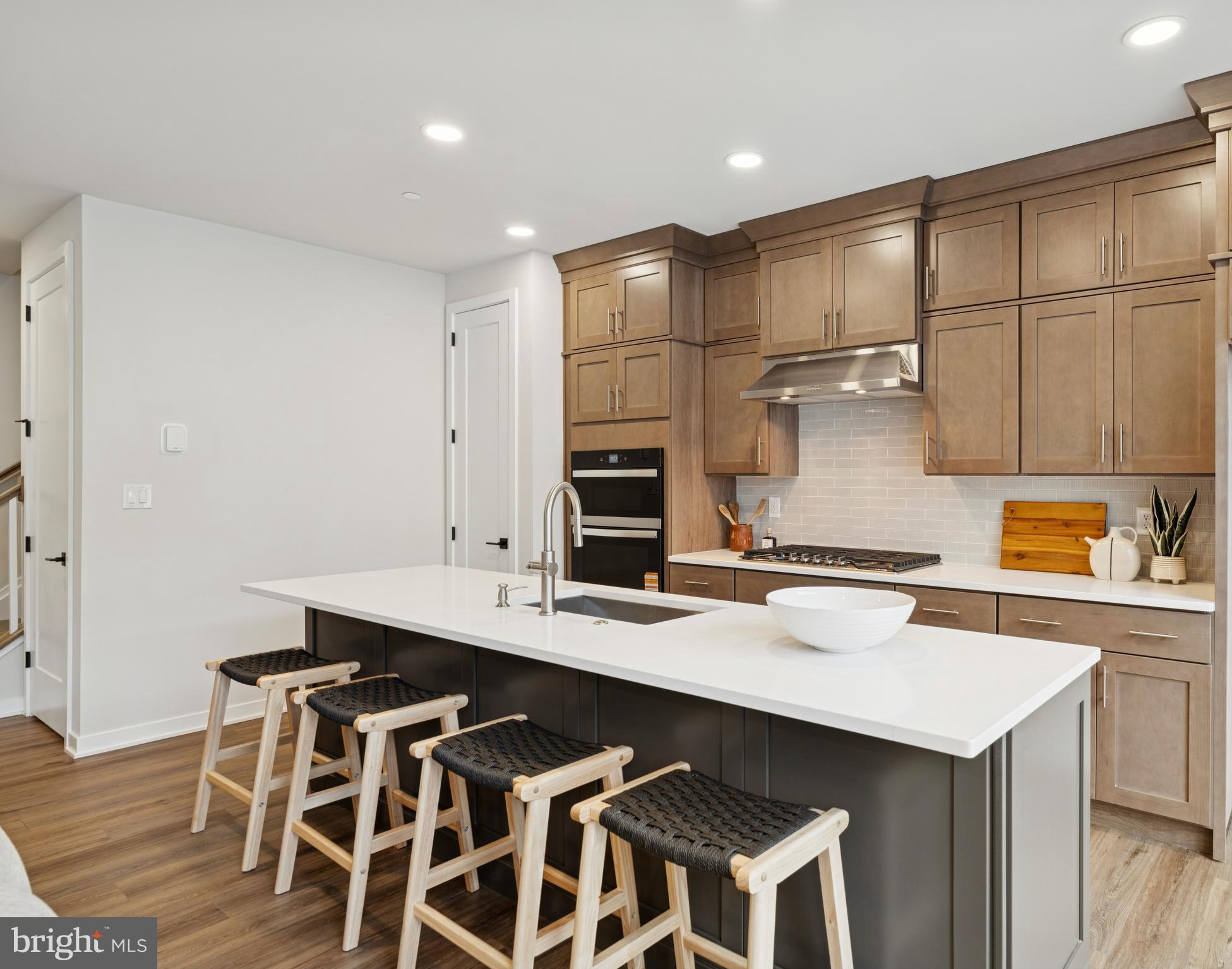 321 Gilman Street Malvern, PA 19355 - Photo 12 of 25 a kitchen with a sink cabinets and wooden floor