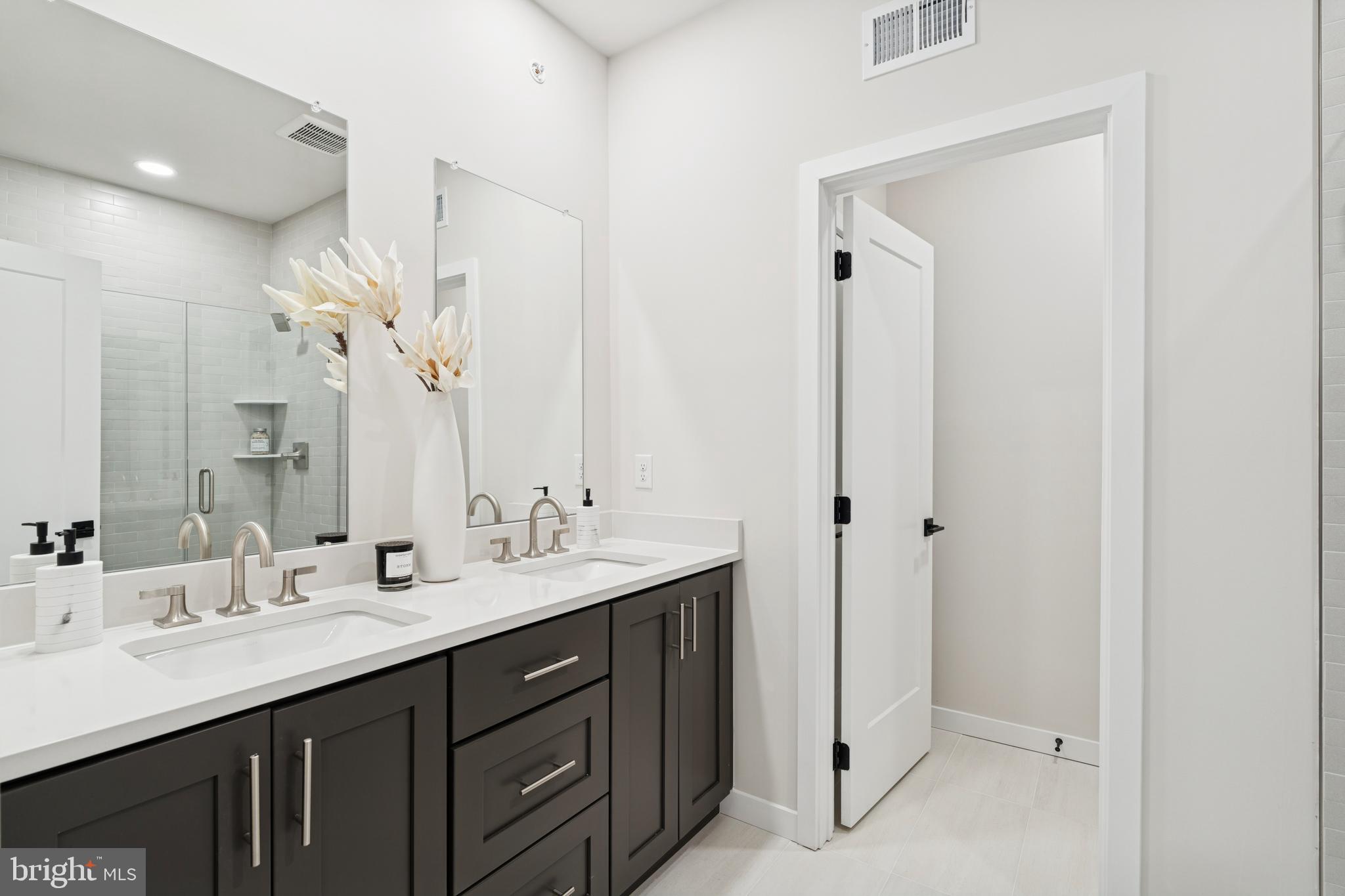321 Gilman Street Malvern, PA 19355 - Photo 21 of 25 a bathroom with a double vanity sink mirror and double