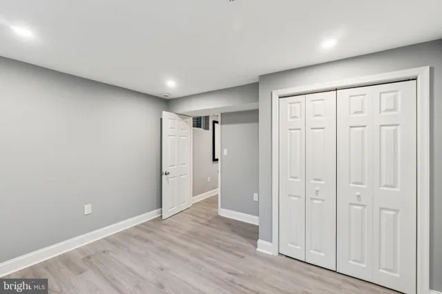 a view of a room with wooden floor and staircase