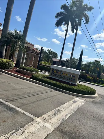 an aerial view of a house lake view and a patio