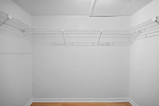 a bathroom with a sink and a mirror with shower