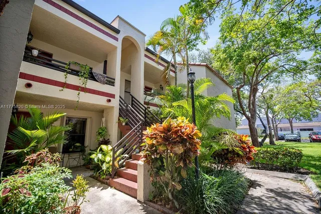 a car parked in front of a brick building