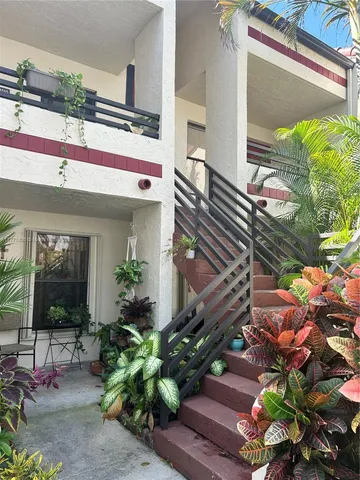 a potted plant sitting in front of a building