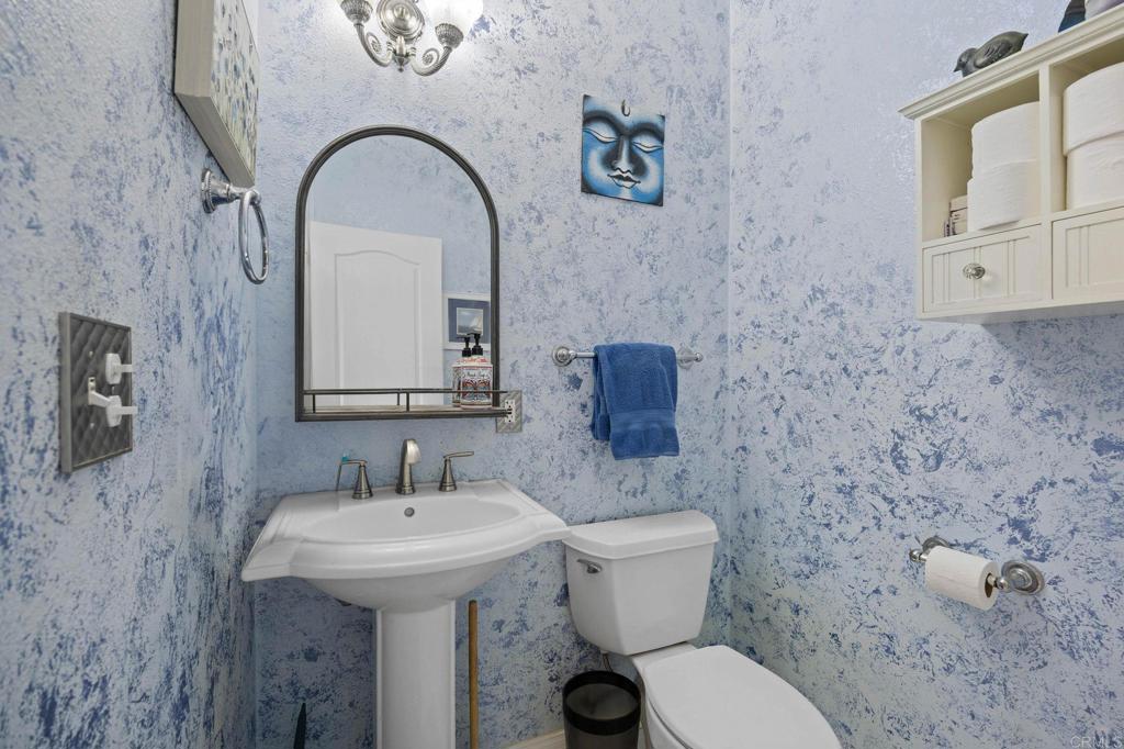 7635 Little Creek Road San Marcos, CA 92078 - Photo 13 of 48 a bathroom with a toilet sink and mirror