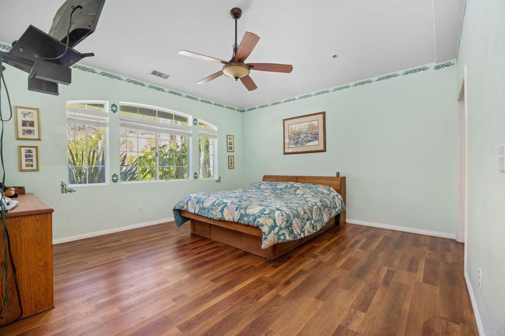 7635 Little Creek Road San Marcos, CA 92078 - Photo 20 of 48 a bedroom with a bed and window