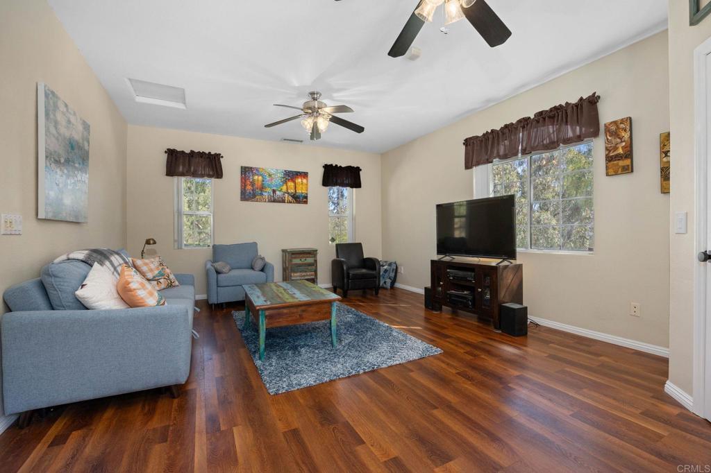 7635 Little Creek Road San Marcos, CA 92078 - Photo 26 of 48 a living room with furniture and a flat screen tv