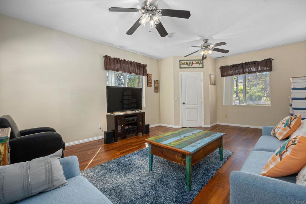 7635 Little Creek Road San Marcos, CA 92078 - Photo 27 of 48 a living room with furniture and a flat screen tv