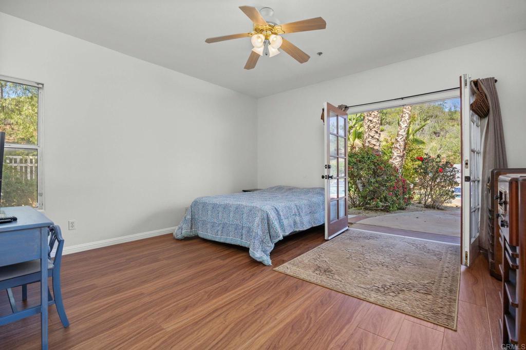 7635 Little Creek Road San Marcos, CA 92078 - Photo 30 of 48 a bedroom with a bed and a window