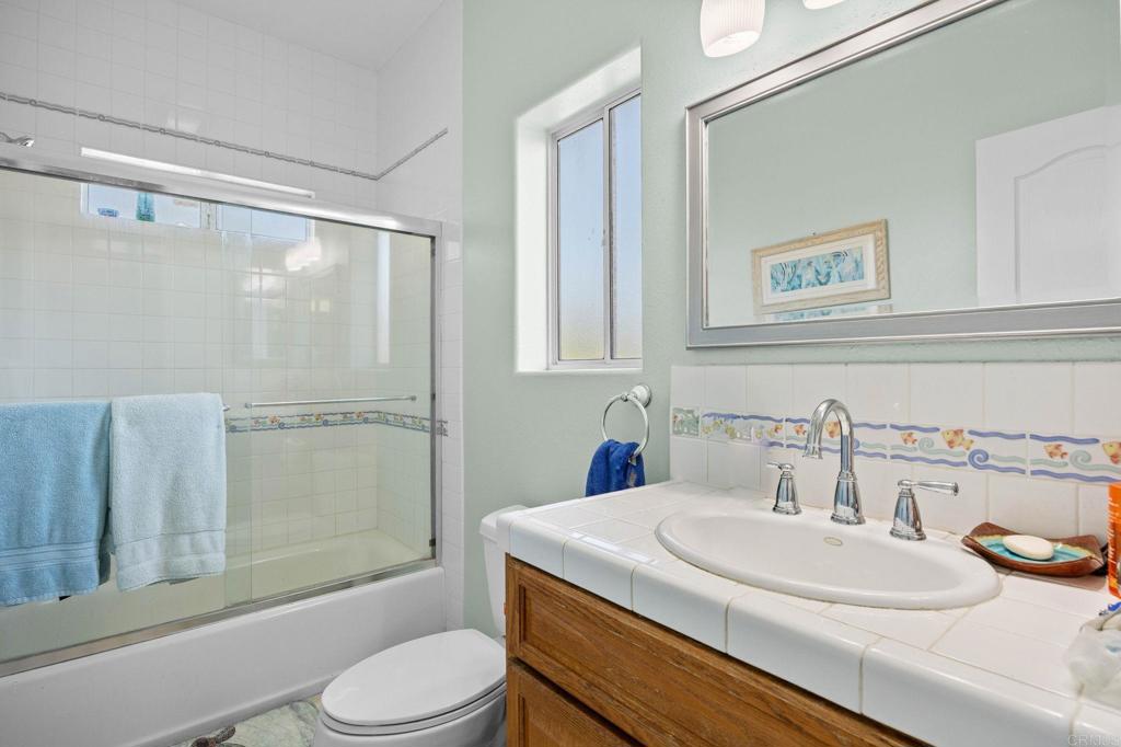 7635 Little Creek Road San Marcos, CA 92078 - Photo 33 of 48 a bathroom with a sink toilet and shower