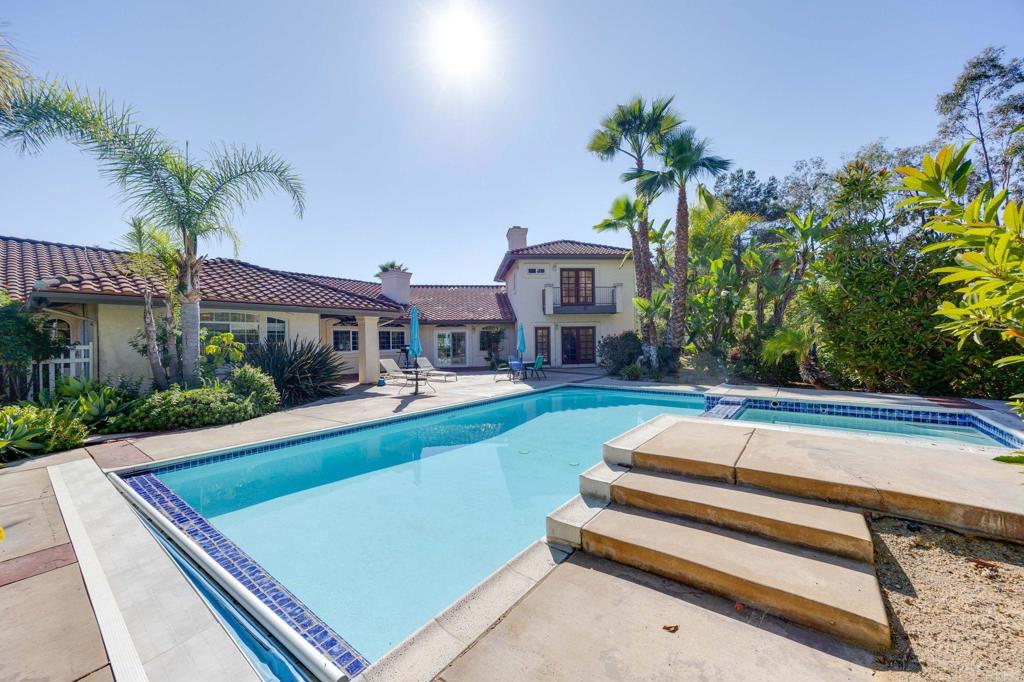 7635 Little Creek Road San Marcos, CA 92078 - Photo 36 of 48 a view of house with swimming pool and a yard
